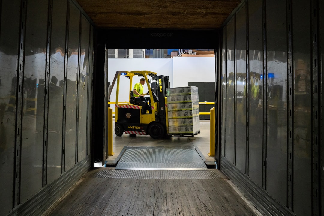 Warehouse worker handling a package during transit, representing Tryyship's reliable handling process